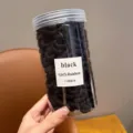 Black hair ties rubber bands set in clear storage jar for daily styling and kids hair accessories - Bucket Black