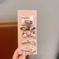 Dettaglio del set di fermagli per capelli con simpatici disegni di coniglietto e fiocco. - Stile Coniglio Con Fiocco / Confezione da 5