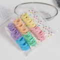 Seamless elastic hair ties detail shot, colorful scrunchies set on display card. - Light Color Series