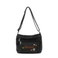 Dark grey denim crossbody bag with multiple compartments, cute embroidered design and adjustable strap. - Black
