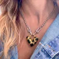 Detailed shot of trendy stainless steel heart pendant necklace with unique black oil drop design. - Steel Color Black Oil Drip Heart (C-61-4) / Steel Color Chain