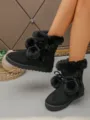 Women short snow boots plush lined thick sole with fur balls and cute bow detail. - Black