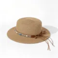 Detailed view of a straw sun hat featuring beaded bands and brown leather ribbon bow. - One Size (Circumference 57cm) / Blue White Beads Wreath - Khaki