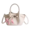 Cream leather bucket bag with cute pink winged horse charm, stylish tote handbag for women. - White
