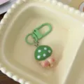 Cute cartoon mushroom butt keychain in candy colors, playful bag accessory and charm pendant. - Green