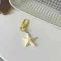 Cute 3D starfish keychain variant, yellow metal clasp and cream pendant, versatile bag charm. - Light Yellow