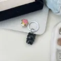 Black cat keychain detail view with flower bell and white ring accessory for cute bags. - Black Cat