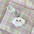 Cute cloud keychain with red heart eyes and pink blush design, ideal for sweet style bags or keys. - Heart