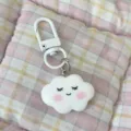 Cute cloud keychain pendant with cute smiling face expression, soft blush design, white clasp charm. - Shy Expression