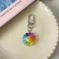 Close up of colorful resin flower keychain with smiling face and metal clasp pendant accessory. - Seven-Color Flower (Shy)