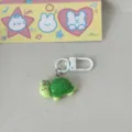 Cute green turtle keychain with white clasp, fun marine life pendant for keys and bags. - Sea Turtle