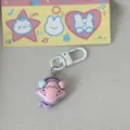 Cute pink stingray keychain with white clasp and shell charms, perfect anime bag pendant gift for friends. - Manta Ray