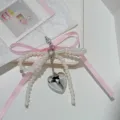 Pearl bow phone charm and bag pendant with pink ribbon and silver heart pendant detail - Pink Bow - Lanyard