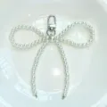 Pearl bow keychain variant, elegant bag charm and phone pendant for women daily accessories. - Pearl Gate Clasp Bow