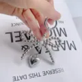 Silver beaded bow keychain with heart pendant, stylish bag charm and phone case accessory. - Ring Clasp Mini Bow Heart