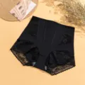 Black high-waist shapewear detail view, breathable lace trim belly control briefs for women. - S / Black