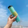 Green hair ties set in clear plastic cylinder container, elastic hair scrunchies for daily use. - Green Series