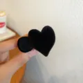 Black flocked heart hair claw clip, stylish back of head catch clip variant display. - Heart Claw Clip Style / Heart Style / Black