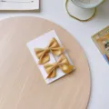 Bonitas pinzas para el cabello doradas con lazo de satén para niñas y accesorios lindos. - Conjunto de 2 Lazos (X8666C) / Amarillo jengibre