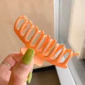 Orange plastic hair claw clip for women, large size hair accessory for styling and shower. - Orange