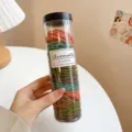 Clear jar with 200 colorful hair ties, elastic rubber bands for daily styling and ponytails. - Dark Green Ribbed 200 Pcs