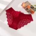 Detail shot of the red lace floral cutout panties, showcasing the delicate lace texture. - S / Bottoms / Red