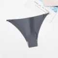 Close-up detail of women's seamless grey thong featuring adjustable side metal rings. - M / Gray
