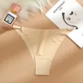Detailed view of low-waist seamless ice silk thong with delicate metal buckle, nude color. - Nude