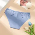 Detail shot of light blue women low rise seamless lace panties with delicate floral waist trim. - S / Blue