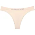 Vista dettagliata del perizoma sportivo a vita bassa color carne con fascia elastica logata. - XL / Pantaloni e gonne / Colore pelle