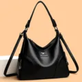 Schwarze Leder Umhängetasche für Damen, elegante Hobo Handtasche mit großem Stauraum. - Schwarz