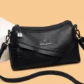 Klassische schwarze Umhängetasche aus weichem Leder für Damen, geräumiges Design. - Schwarz