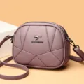 Damen lila Umhängetasche schicke gesteppte runde Schultertasche 2024 neues Modell Detail - Lila