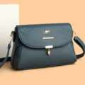 Elegante dunkelblaue Damen Umhängetasche aus Leder mit stilvollem geprägtem Blattmuster Design. - Blau