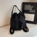 Schwarzer Nylon Eimer Rucksack Damen, lässiger stylischer Kordelzug Umhängetasche - Schwarz