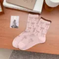 Roze halfhoge sokken met strikprint en bruine contrasterende geribbelde boord dames. - Eén maat / Roze