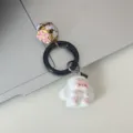 Cute cartoon bunny rabbit keyring detail showing plush charm and golden bell pendant for bag. - White