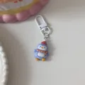 Cute winter cartoon penguin keychain metal hook backpack pendant detail close-up - Penguin