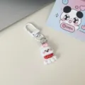 White cute puppy keychain detail showing resin dog pendant with pink bow and red polka dot scarf. - Red Polka Dot Bib Dog
