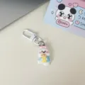 Dettaglio portachiavi cucciolo bianco carino, adorabile ciondolo borsa cartone animato per uso. - Cane che mangia pane