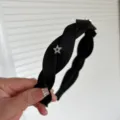Black braided headband featuring a sparkling rhinestone star detail, stylish hair accessory. - Black Star Rhinestone Braided Headband