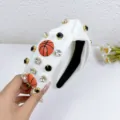 White fabric knotted headband with sparkling rhinestones and cute basketball charms. - White