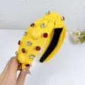 Yellow knotted headband with sparkling red and clear crystals and cute tennis ball accents. - Yellow