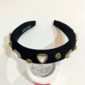 Black padded headband with vintage gold cross charms and sparkling crystal rhinestones. - Triangle Rhinestone Headband - Black