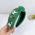 Green fabric knotted headband decorated with shiny rhinestones and cute soccer ball charms. - Green