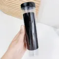 Μαύρα ελαστικά λάστιχα μαλλιών σε διαφανή σωλήνα αποθήκευσης για γυναίκες. - Μαύρο