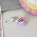 Leuke 3D taart sleutelhanger detail met schattige paarse gebak punt hanger voor tassen. - Paars