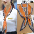 Detailed view of the narrow floral silk scarf with elegant orange and grey design. - HF-010