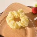 Yellow textured puff scrunchie for women, cute elastic hair band for daily hairstyles. - Yellow