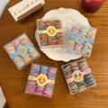 Piccoli elastici per capelli colorati in scatole trasparenti, graziosi elastici per styling quotidiano. - 100 Pezzi/Confezione / Multicolore